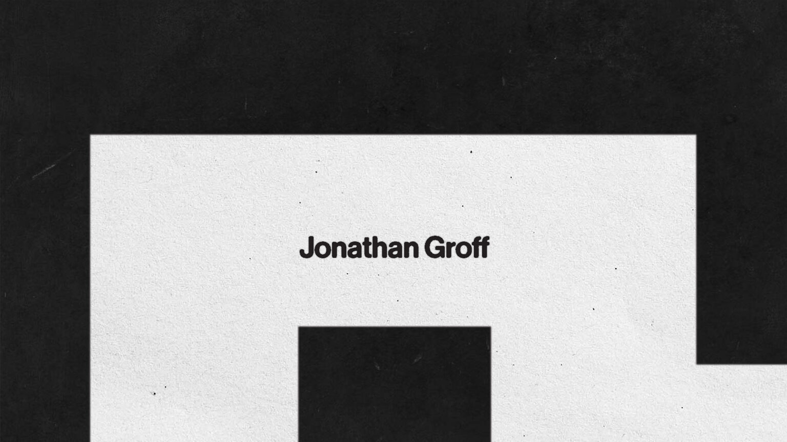 A title screen of Jonathan Groff and black square encircling the name.