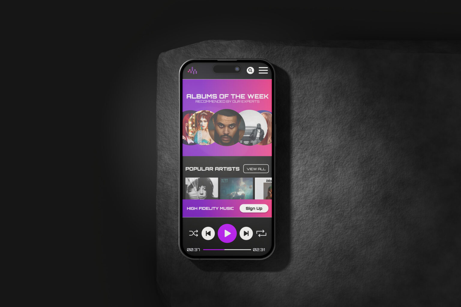 Image of a phone with the homepage of Deezer on it.