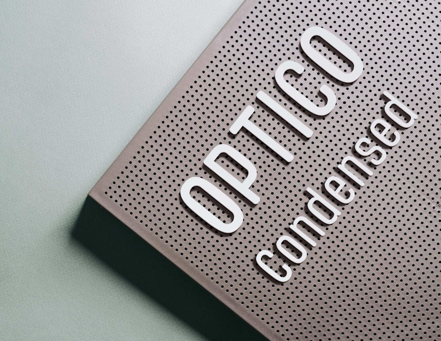 Photo of Pegboard with the letters Optico Condensed written out.